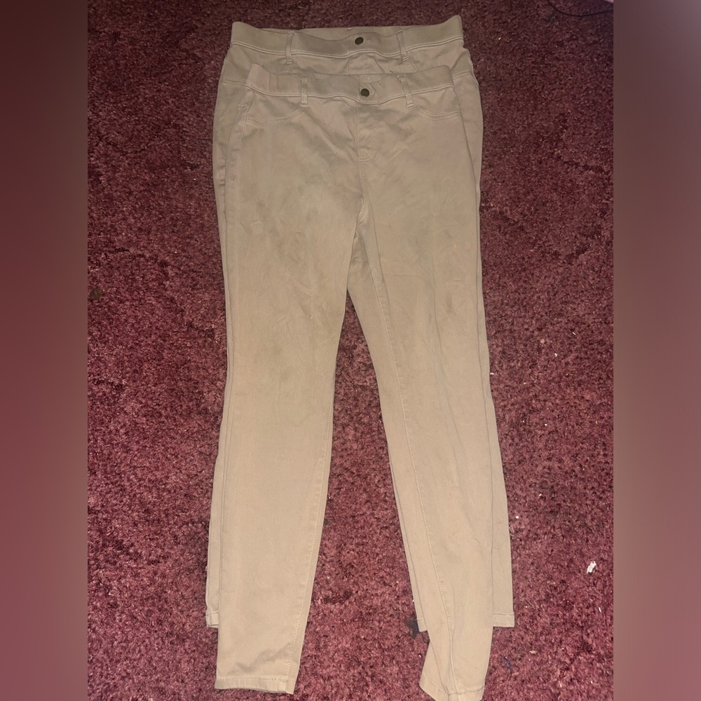 two pairs of khaki jeggings.. M + L